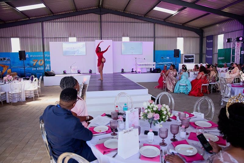 Guests gather around tables at a foundation dinner.